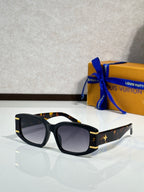 Louis Vuitton black sunglasses with square frames and star logo on temples