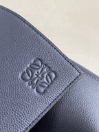 Embossed Loewe logo on textured blue leather flap panel