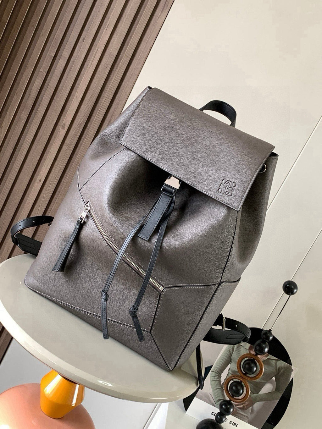Loewe men’s bag, metallic gray, flap top with drawstring cords, front view