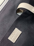 Loewe bag close-up of fabric texture with a light leather label patch