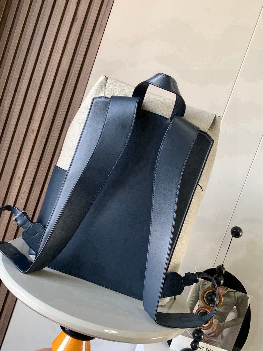 Loewe bag with dark blue front panels, open top, and contrasting light side panels