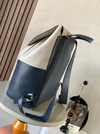 Loewe men's bag with cream top and blue bottom panels, ribbon straps and side buckle