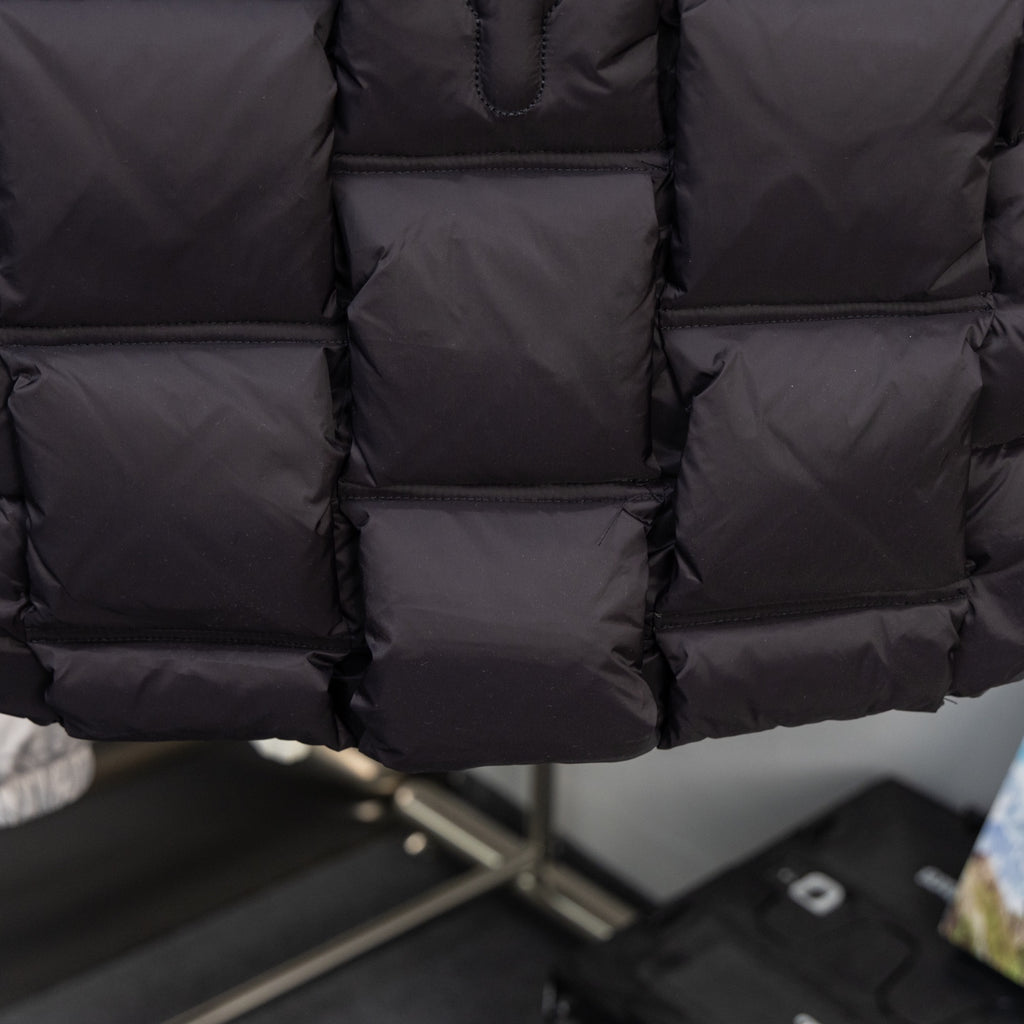 Moncler black puffer vest hem with quilted stitch pattern