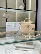 Small quilted leather top-handle bag with gold chain strap and clasp hardware