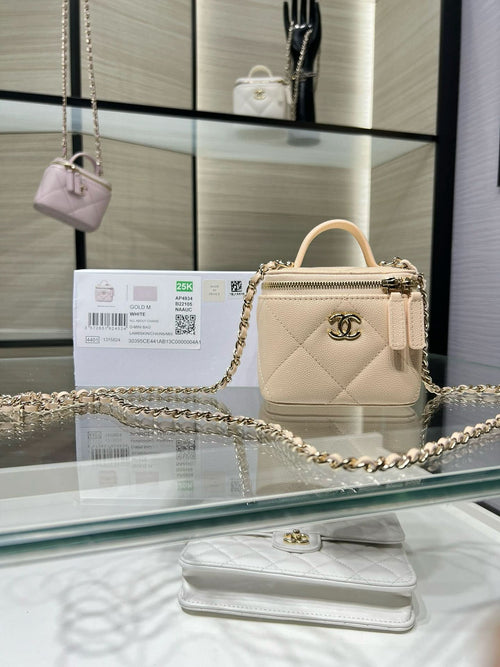 Small quilted leather top-handle bag with gold chain strap and clasp hardware
