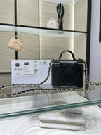 Black mini quilted leather bag with gold chain strap and CC emblem, top handle