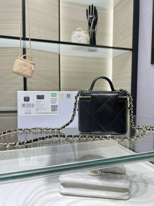 Black mini quilted leather bag with gold chain strap and CC emblem, top handle