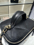 Black textured leather mini bag with gold chain strap and top handle, CC emblem