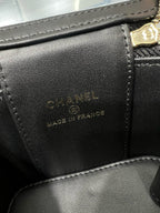 Black leather bag interior label reading CHANEL and MADE IN FRANCE