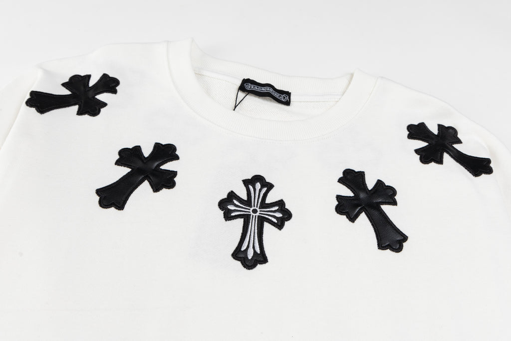 White crewneck sweatshirt with scattered black cross appliques