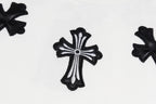 White crewneck sweatshirt with central black cross applique close-up