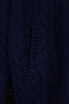 Navy knit quarter-zip sweater front seam and zipper placket detail