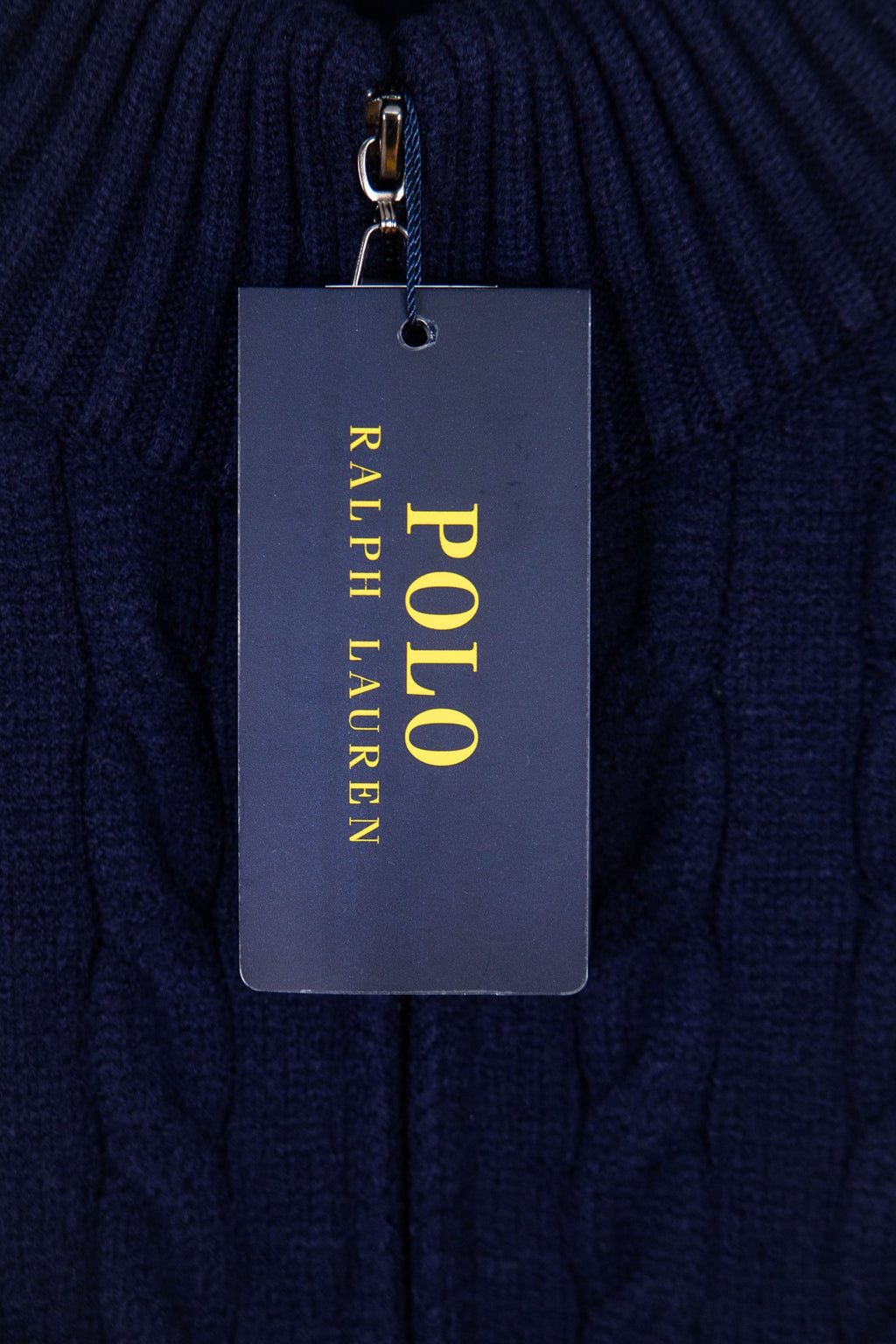 Navy knit quarter-zip sweater with hanging tag marked “Polo Ralph Lauren”
