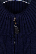 Navy knit quarter-zip sweater showing zipper pull and dark placket detail