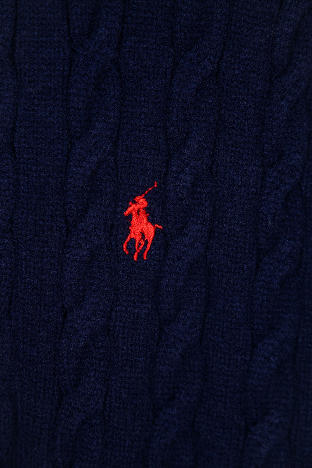 Navy knit sweater with small red Polo pony logo at chest