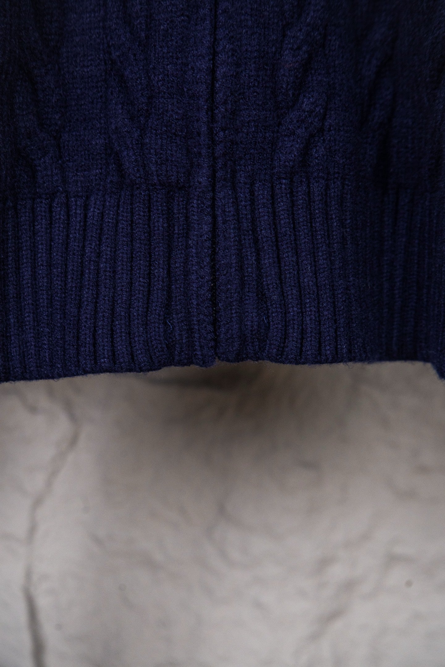 Cable knit sweater with ribbed hem in dark navy