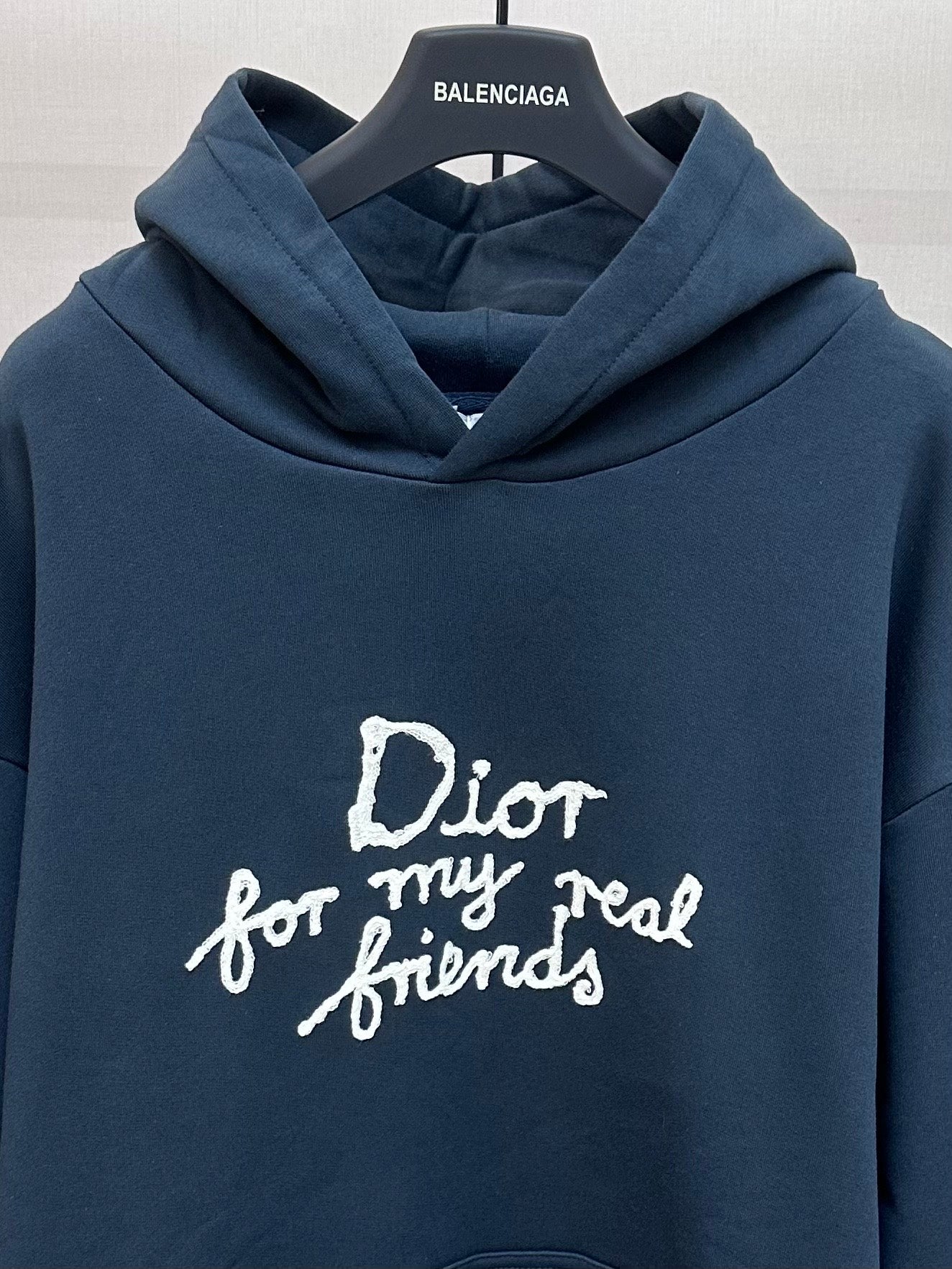 Dark blue hoodie with large white 'Dior for my real friends' lettering on chest