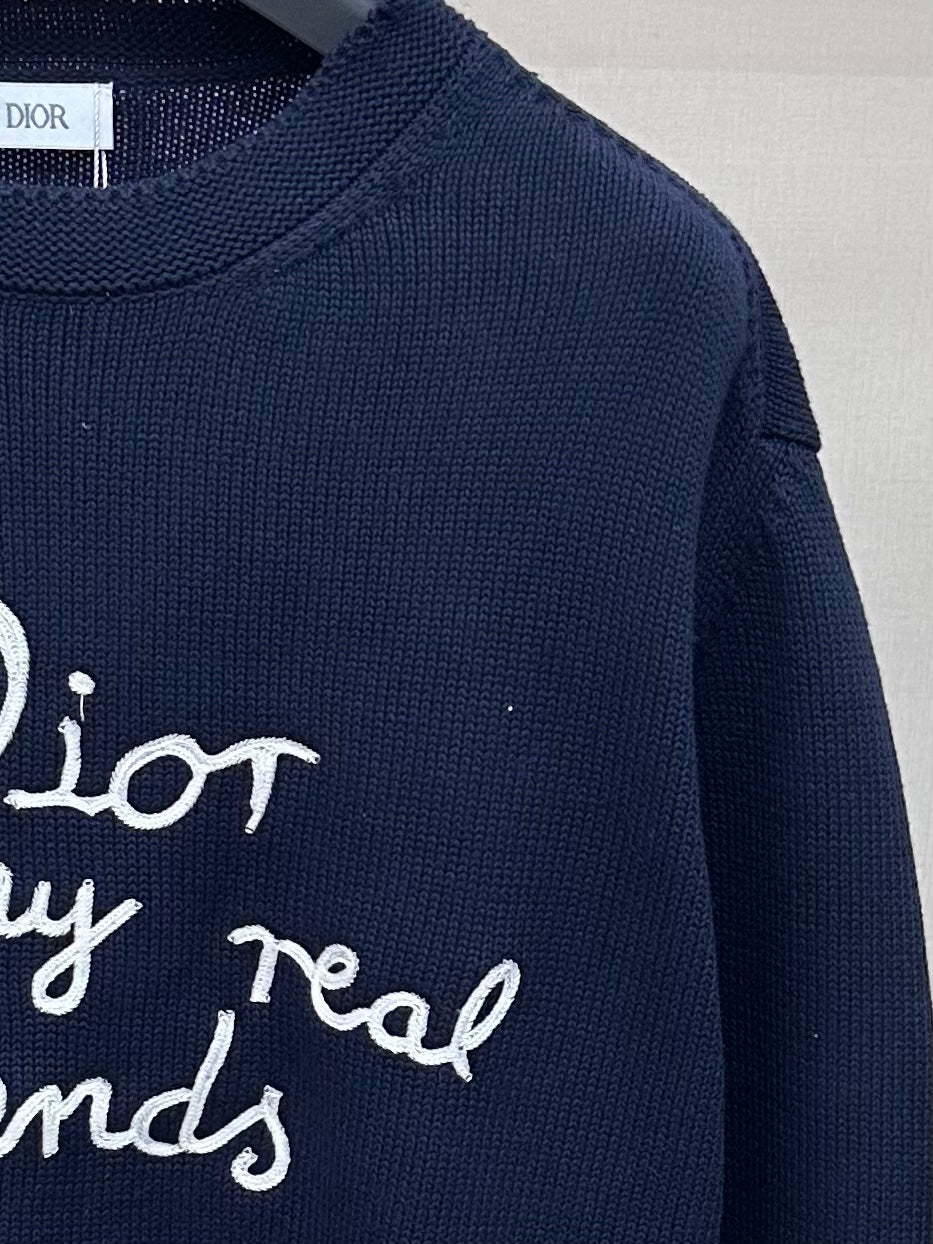 Navy Dior knit sweater close-up of 'for my real friends' text graphic