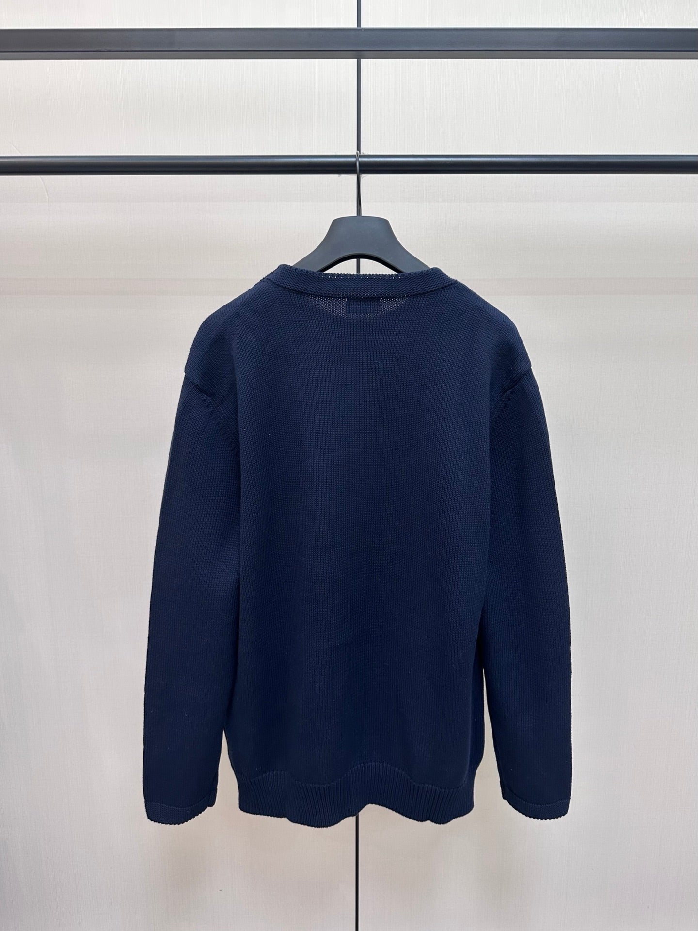 Navy Dior knit sweater back view with ribbed crew neckline