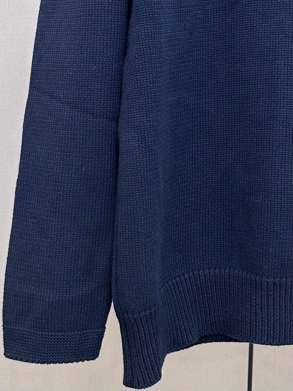 Navy Dior knit sweater ribbed sleeve cuff and hem detail