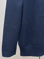 Navy Dior knit sweater side view with ribbed hem