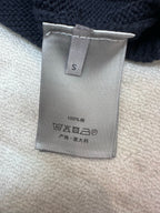 Dior size tag with care symbols on navy knit sweater, 100% wool
