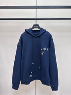 Navy hoodie with hood, drawstrings, kangaroo pocket, and small sailboat graphic