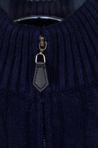 Navy quarter-zip sweater zipper with gray leather pull tab