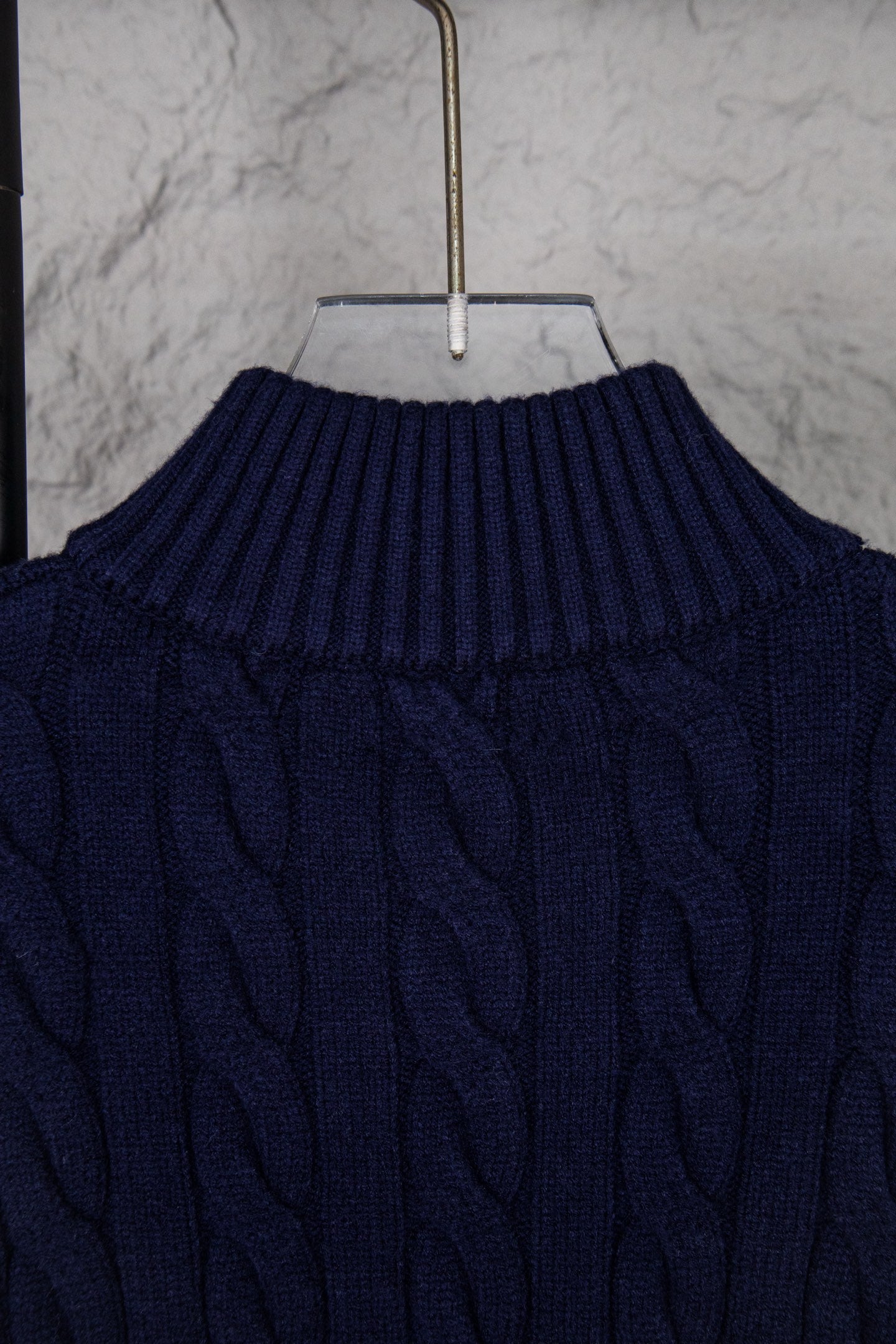 Navy cable-knit sweater high ribbed turtleneck collar