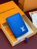 Blue Louis Vuitton card holder with LV monogram on front, textured leather.