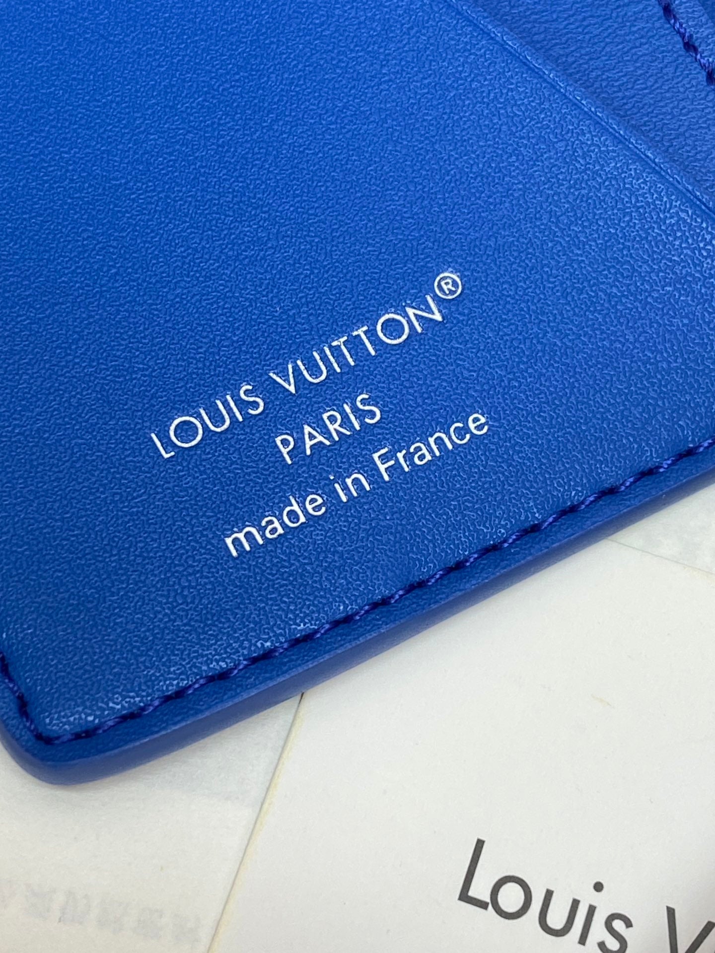 Blue Louis Vuitton small bag corner close-up with 'made in France' text