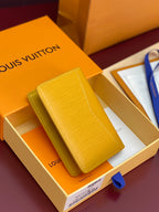 Yellow textured leather card holder, LV logo panel on exterior