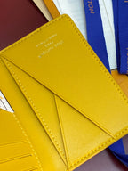 Louis Vuitton card holder inside, yellow leather card slots and stitched fold divider