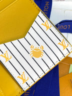 Striped white lining of card holder with gold bee and LV marks