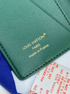 Louis Vuitton small bag wallet, teal green underside with “made in France” stamp