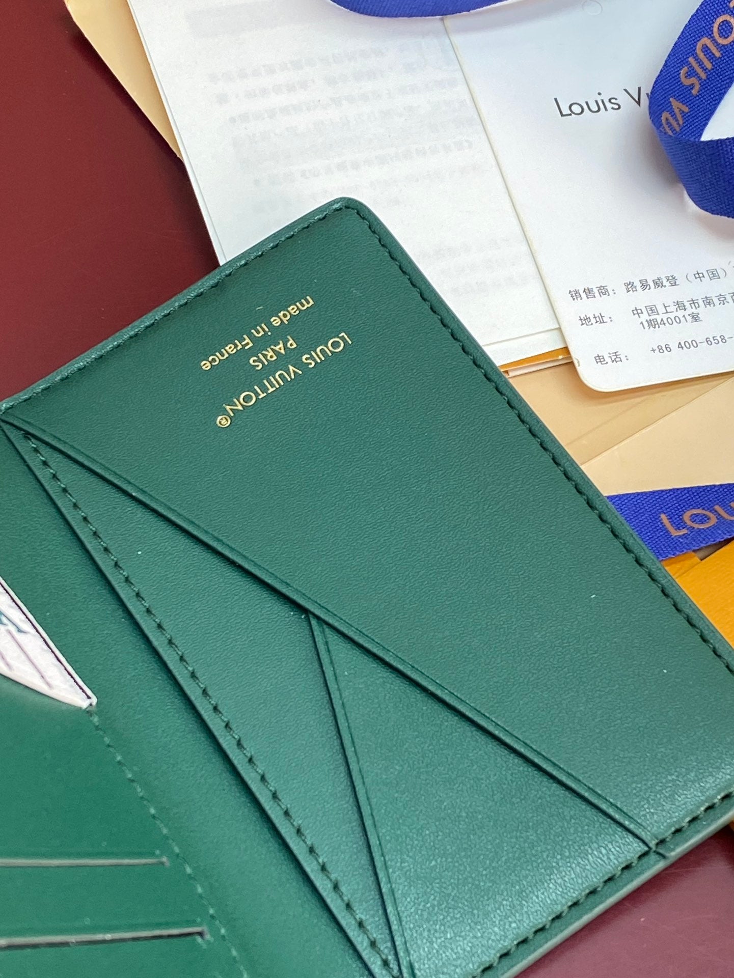 Louis Vuitton small bag wallet, teal green back with stitching and front flap fold