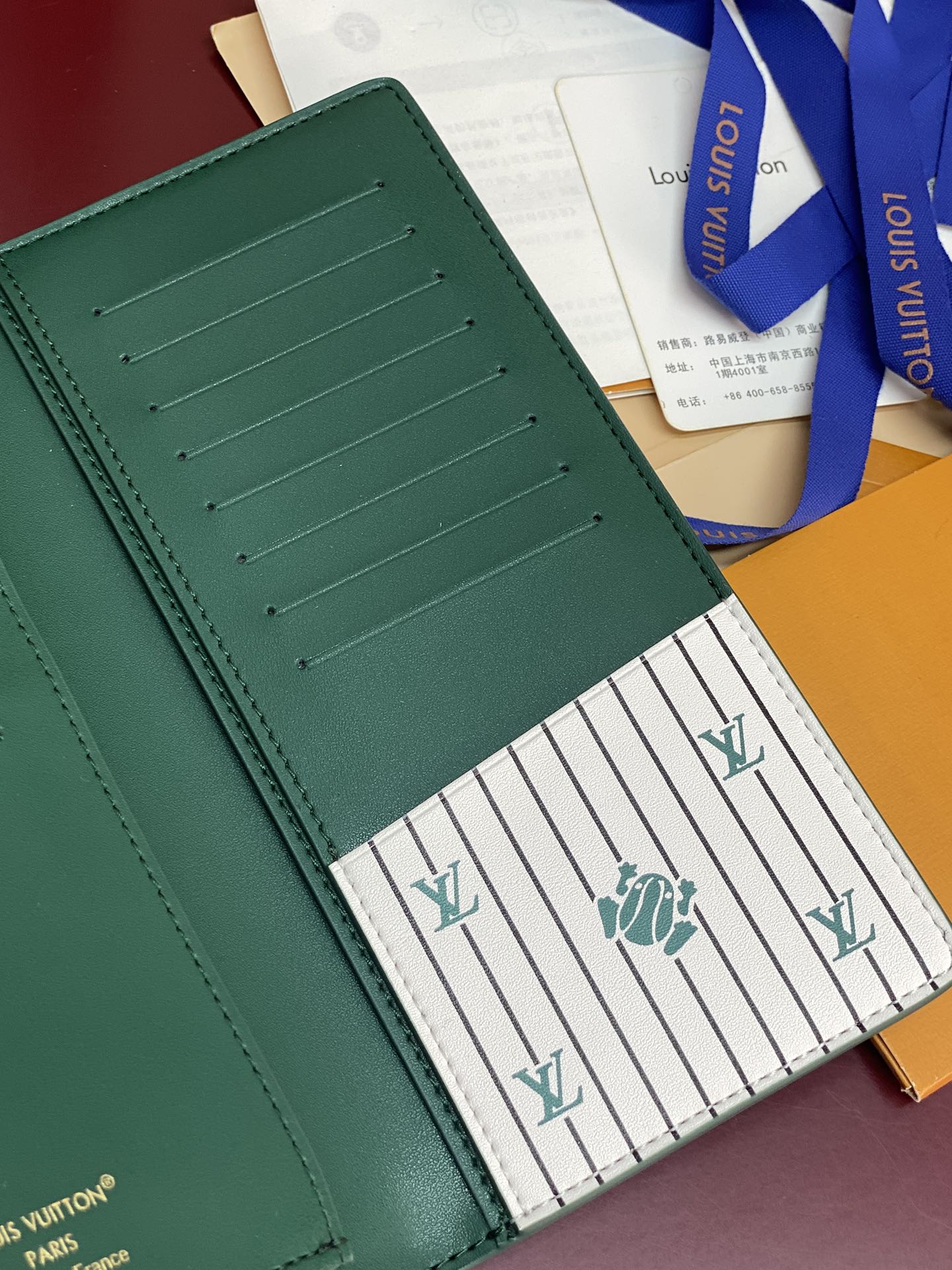 Teal small wallet interior card slots with stitched edges and striped panel