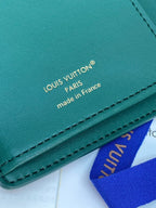 Teal leather wallet with embossed Louis Vuitton Paris and made in France text