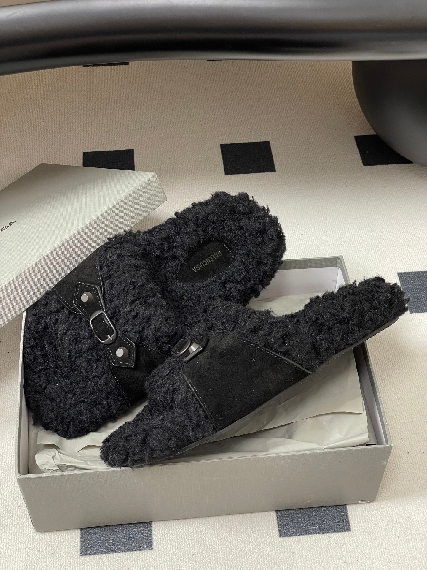 Black Balenciaga slip-on sandals with thick teddy-fleece straps and buckles