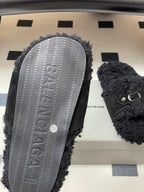 Black Balenciaga sandals shown from sole, textured rubber tread
