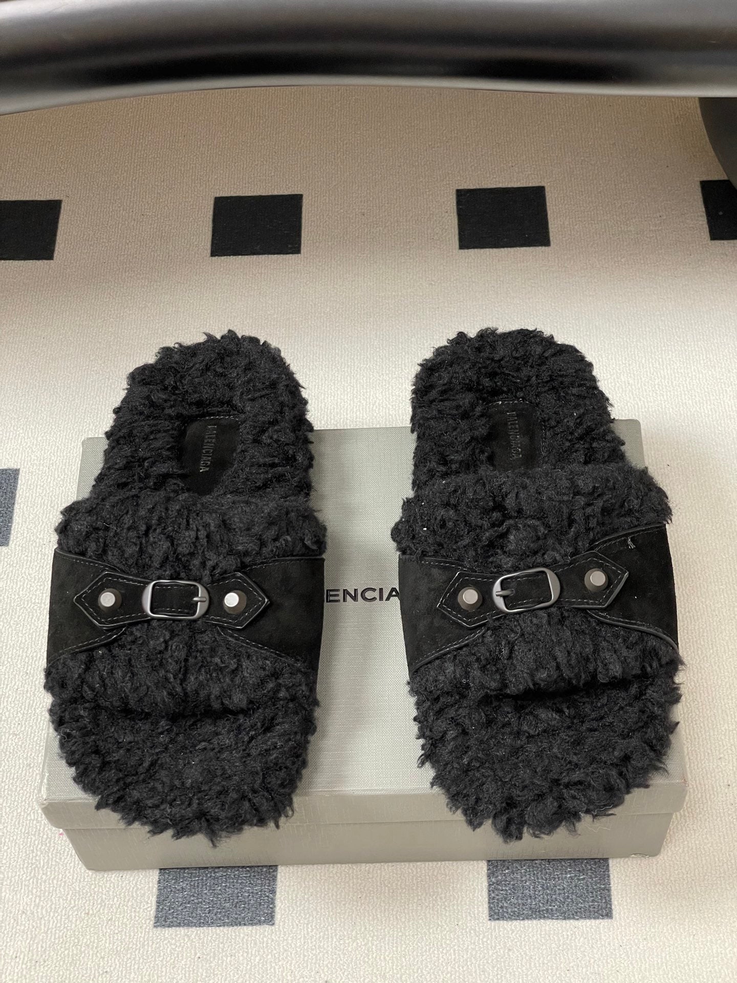 Black Balenciaga slide sandals with double-stud strap and oval metal buckle
