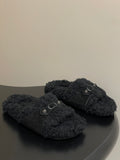Black Balenciaga shearling-style sandals with front buckle straps