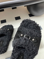Black Balenciaga sandals with front strap and oval metal buckle, close-up