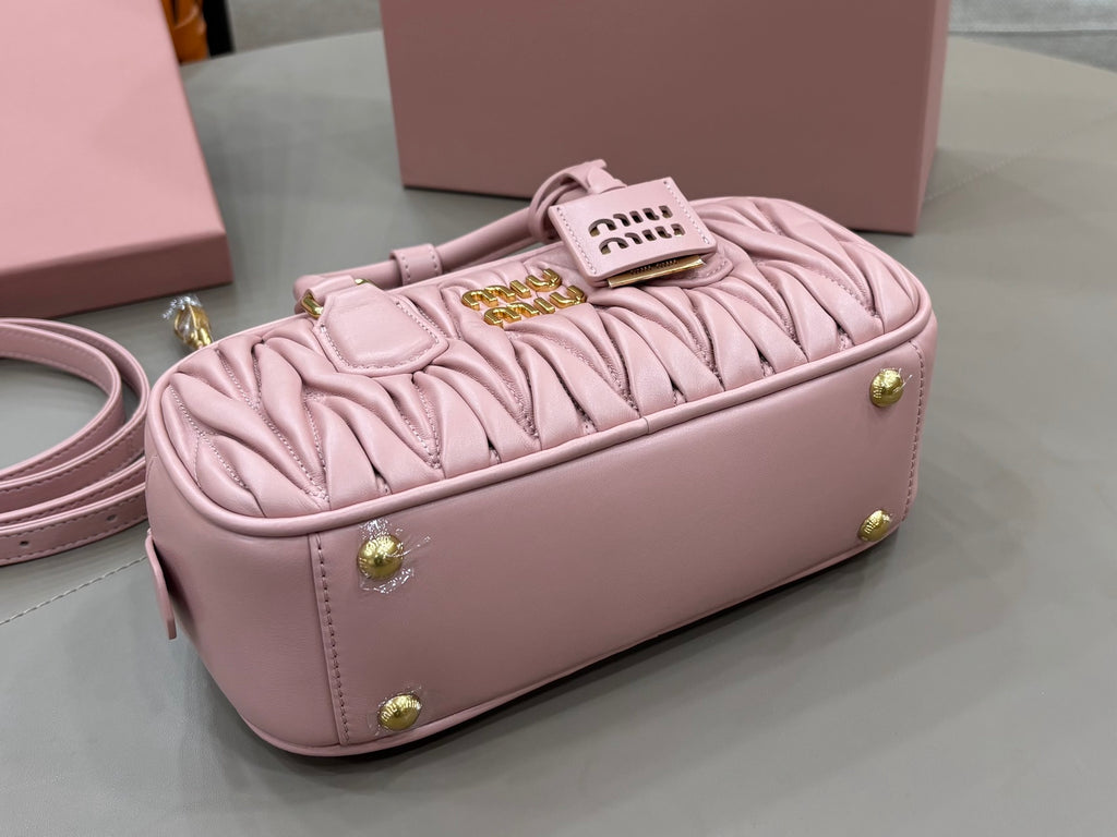 Miu Miu light pink mini gathered bag with gold feet and logo tag