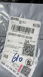 Shipping label with barcode and tracking number on paper
