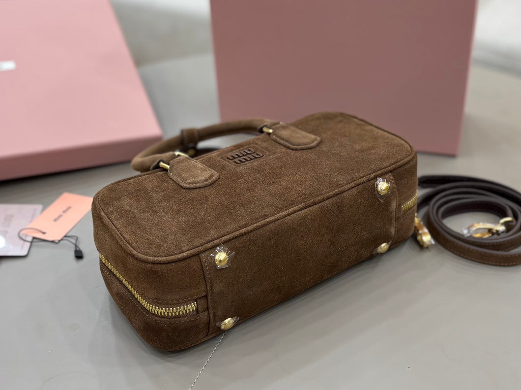 Suede mini bag with front flap detail, gold-tone studs, and crossbody strap