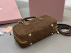 Suede mini bag with front flap detail, gold-tone studs, and crossbody strap