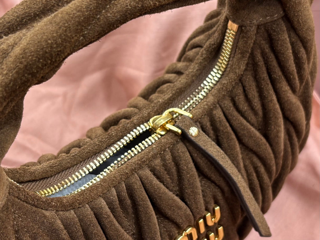 MiuMiu ruched hobo bag zipper close-up, gold zipper and olive-brown fabric