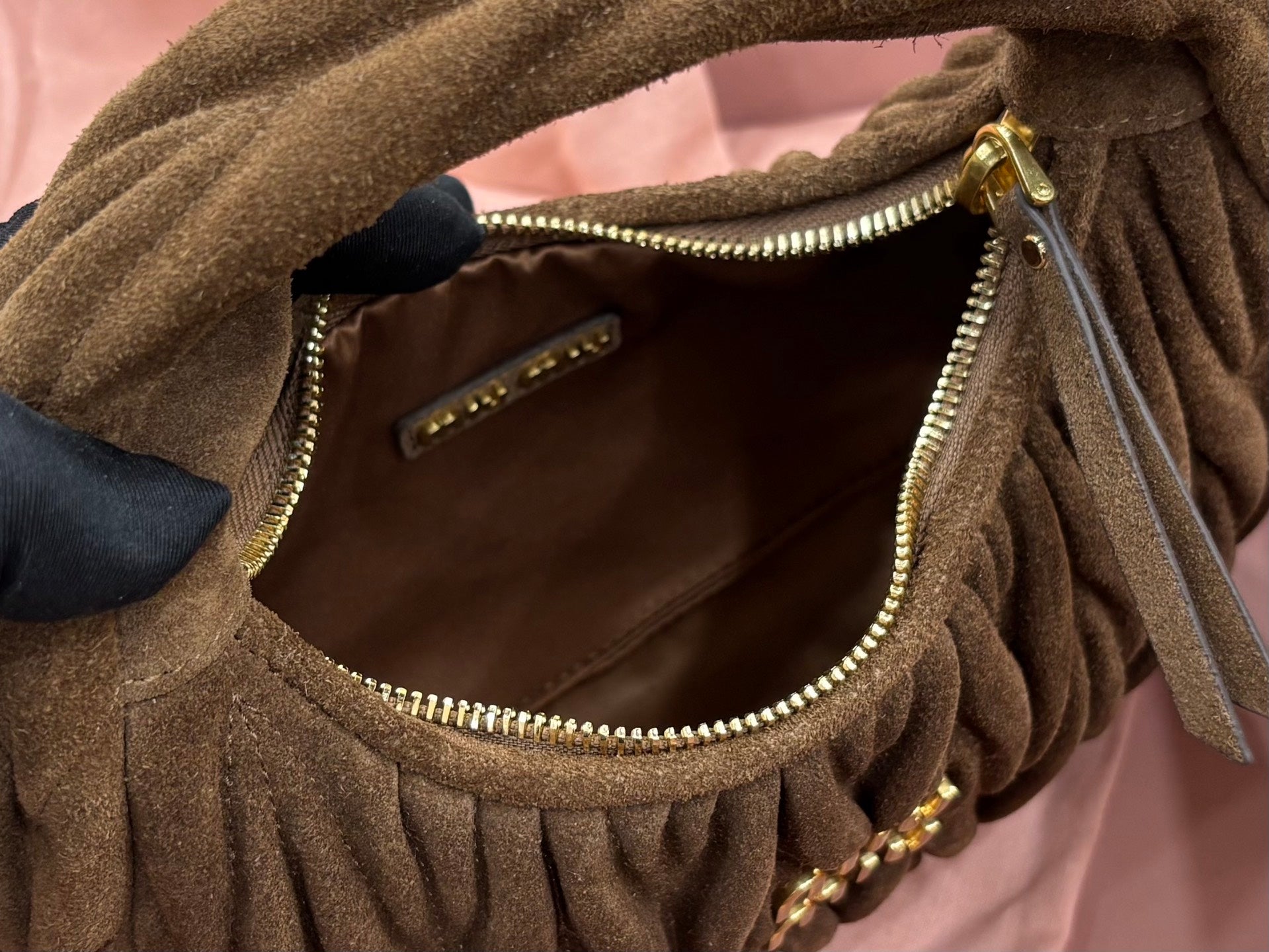 MiuMiu ruched hobo bag inner pocket detail with zipper, olive-brown exterior