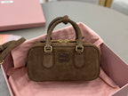 Suede mini handbag with top handles and gold hardware, front logo plaque